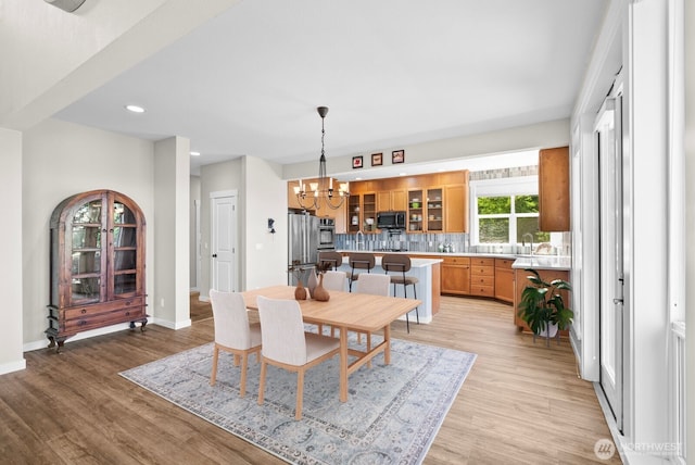 5675 E Hillcrest Dr, Port Orchard, WA 98366 - dining area featuring a chandelier, light wood finished floors, baseboards, and recessed lighting