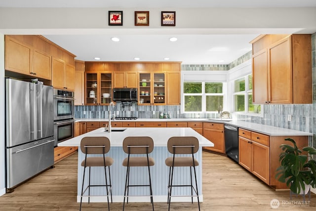 5675 E Hillcrest Dr, Port Orchard, WA 98366 - kitchen featuring stainless steel appliances, a sink, light countertops, backsplash, and recessed lighting