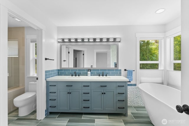 5675 E Hillcrest Dr, Port Orchard, WA 98366 - full bathroom with a freestanding bath, double vanity, toilet, recessed lighting, and a shower