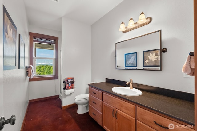 5675 E Hillcrest Dr, Port Orchard, WA 98366 - bathroom featuring toilet, vanity, and baseboards