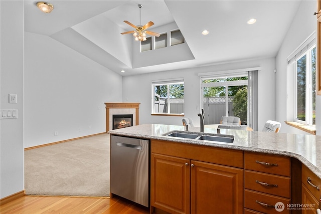 509 Clover Ln, Bellingham, WA 98226 - kitchen with stainless steel dishwasher, a sink, open floor plan, light stone countertops, and a ceiling fan