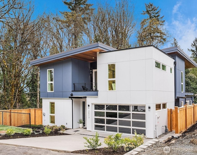 3973 162nd Pl SE, Bellevue, WA 98006 - modern home featuring a balcony and concrete driveway