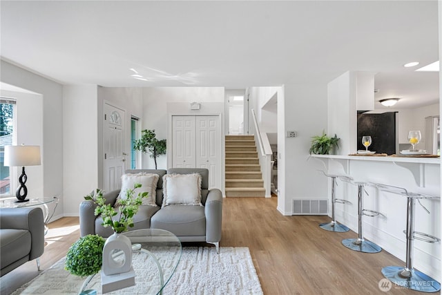7718 NE 183rd St, Kenmore, WA 98028 - living area with stairs, light wood-type flooring, and baseboards