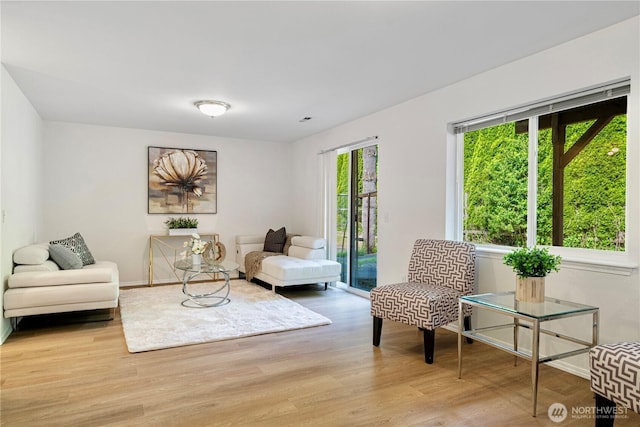 7718 NE 183rd St, Kenmore, WA 98028 - living area featuring wood finished floors and baseboards
