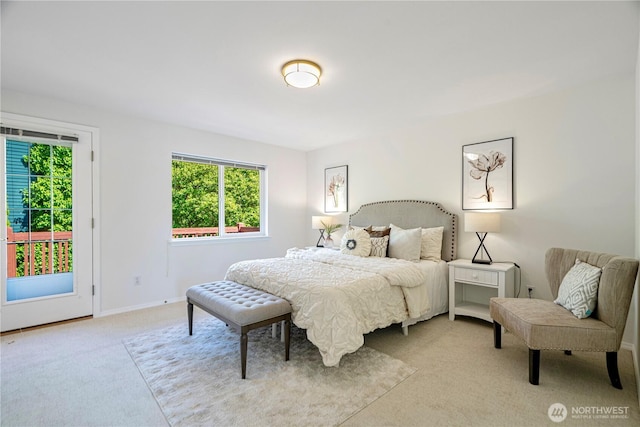 7718 NE 183rd St, Kenmore, WA 98028 - carpeted bedroom featuring multiple windows, access to exterior, and baseboards