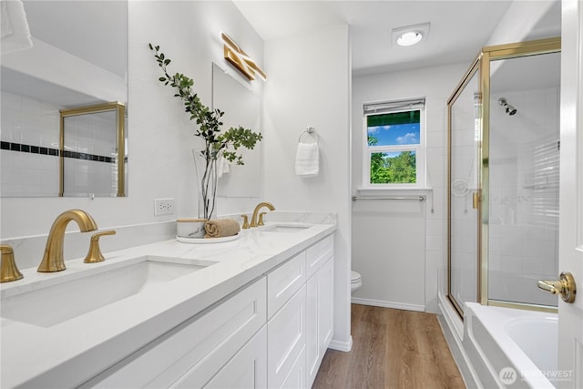7718 NE 183rd St, Kenmore, WA 98028 - full bathroom featuring a stall shower, toilet, double vanity, a bath, and wood finished floors
