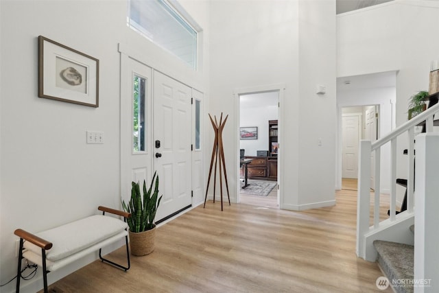 27716 NE 30th St, Redmond, WA 98053 - foyer featuring stairway, light wood-style flooring, a high ceiling, and baseboards