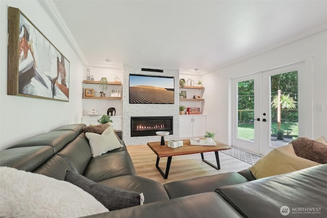 27716 NE 30th St, Redmond, WA 98053 - living room with wood finished floors, ornamental molding, french doors, a large fireplace, and built in shelves