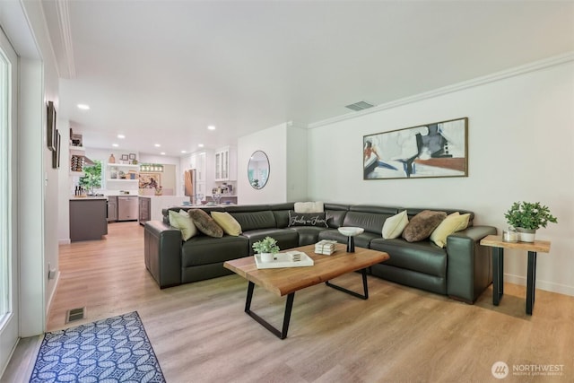 27716 NE 30th St, Redmond, WA 98053 - living area featuring light wood-style flooring, crown molding, recessed lighting, and baseboards