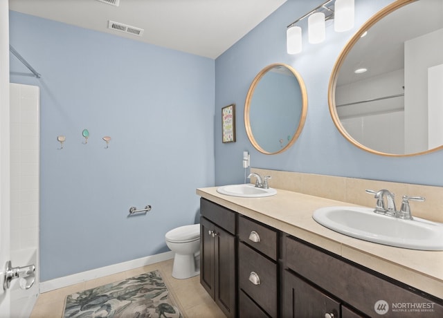303 Vaughan Blvd NE, North Bend, WA 98045 - bathroom featuring toilet, double vanity, tile patterned floors, and shower / tub combination