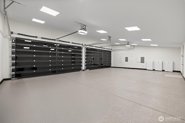 204 Northside Rd, Bellevue, WA 98004 - garage with a garage door opener and baseboards