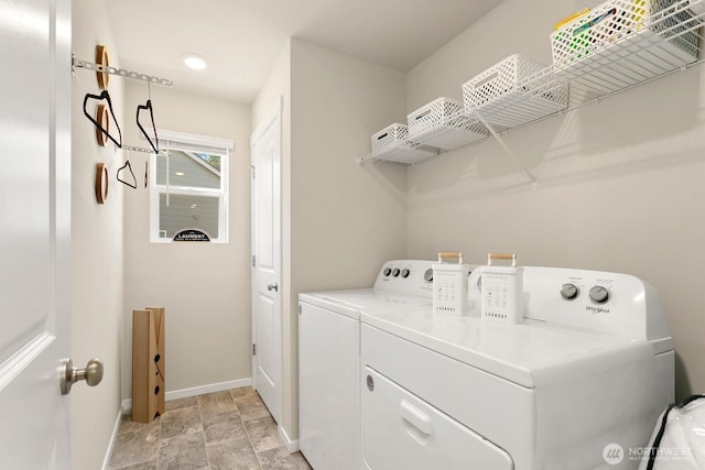 6451 Randolph Dr NE, Bremerton, WA 98311 - laundry area featuring baseboards, washing machine and dryer, and light stone finish flooring