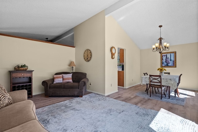 11726 130th Avenue Ct E, Puyallup, WA 98374 - living area featuring a chandelier, wood finished floors, and baseboards