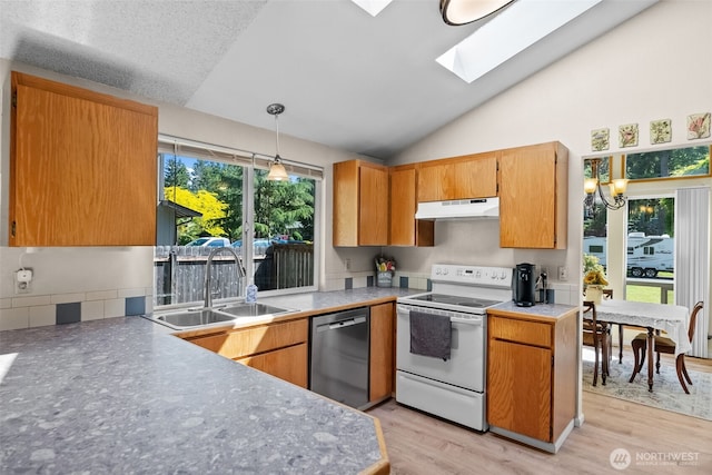 11726 130th Avenue Ct E, Puyallup, WA 98374 - kitchen with white range with electric stovetop, dishwasher, under cabinet range hood, a sink, and vaulted ceiling