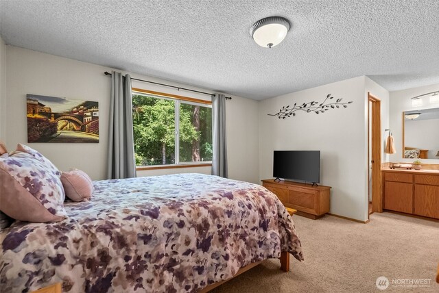 11726 130th Avenue Ct E, Puyallup, WA 98374 - bedroom with light carpet, a textured ceiling, and ensuite bathroom