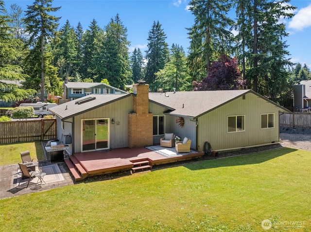 11726 130th Avenue Ct E, Puyallup, WA 98374 - back of property featuring a chimney, a wooden deck, and a shingled roof