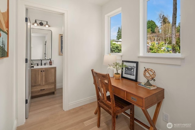 6707 117th Ave NE, Kirkland, WA 98033 - office area featuring a sink, light wood finished floors, and baseboards