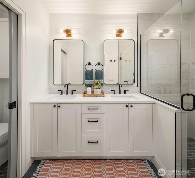 6707 117th Ave NE, Kirkland, WA 98033 - bathroom featuring double vanity, toilet, and a shower stall
