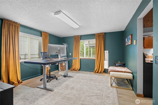 37911 300th Ave SE, Enumclaw, WA 98022 - office space with a textured ceiling, wood finished floors, and baseboards