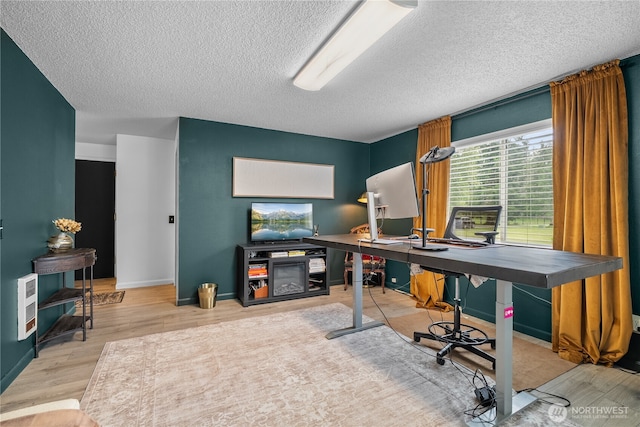 37911 300th Ave SE, Enumclaw, WA 98022 - home office with a textured ceiling, wood finished floors, and baseboards
