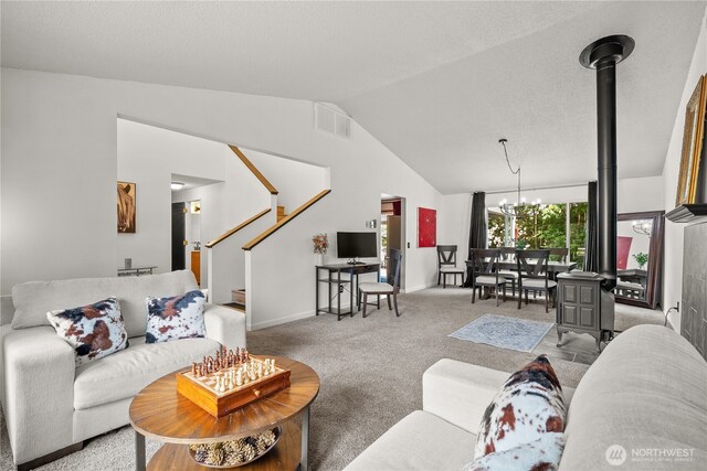 37911 300th Ave SE, Enumclaw, WA 98022 - living room with lofted ceiling, carpet floors, a chandelier, stairs, and baseboards
