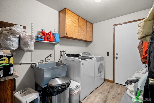37911 300th Ave SE, Enumclaw, WA 98022 - washroom featuring cabinet space, washing machine and dryer, and light wood-type flooring