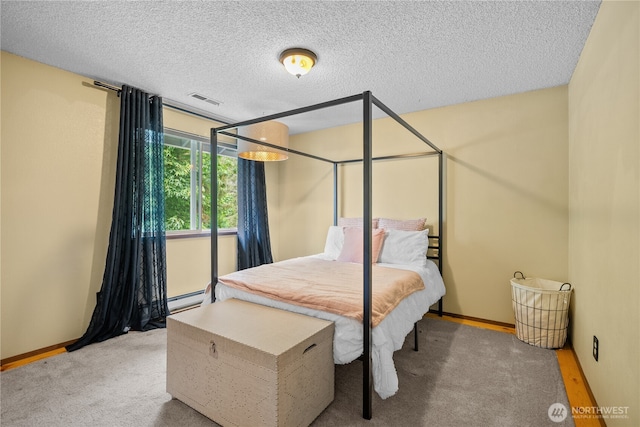 37911 300th Ave SE, Enumclaw, WA 98022 - carpeted bedroom with a baseboard radiator, a textured ceiling, and baseboards