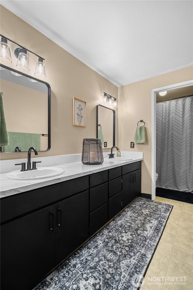 37911 300th Ave SE, Enumclaw, WA 98022 - full bathroom featuring double vanity and toilet