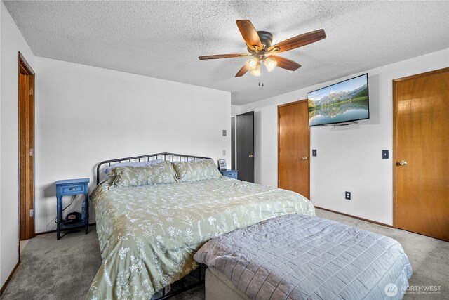 37911 300th Ave SE, Enumclaw, WA 98022 - carpeted bedroom with a textured ceiling, a ceiling fan, and baseboards