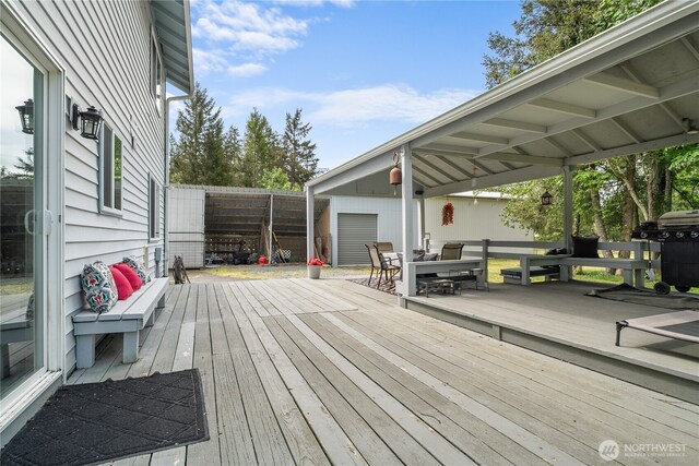 37911 300th Ave SE, Enumclaw, WA 98022 - deck with outdoor dining area and a fenced backyard
