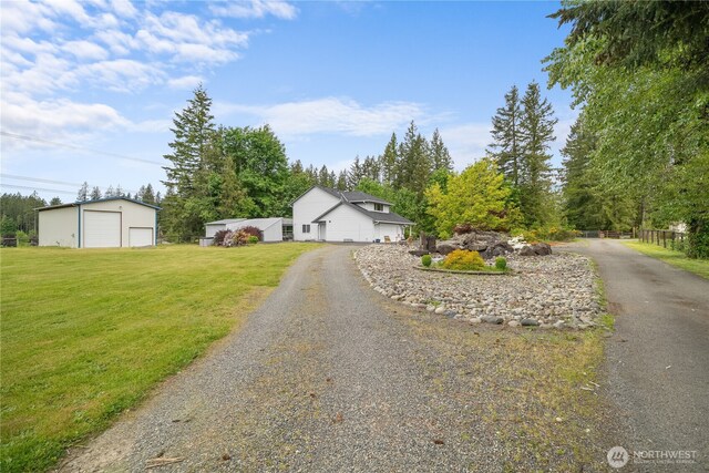 37911 300th Ave SE, Enumclaw, WA 98022 - view of front of property with a garage, a front lawn, and an outbuilding