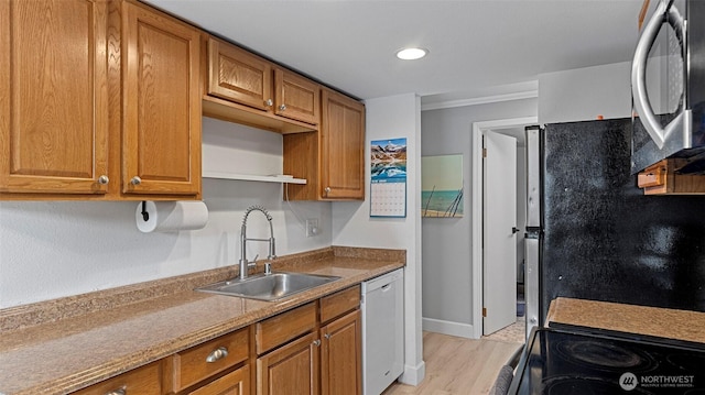 323 128th St SE Unit K120, Everett, WA 98208 - kitchen featuring a sink, dishwashing machine, black microwave, brown cabinets, and recessed lighting