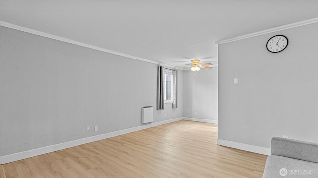 323 128th St SE Unit K120, Everett, WA 98208 - spare room featuring light wood-style floors, baseboards, crown molding, and ceiling fan