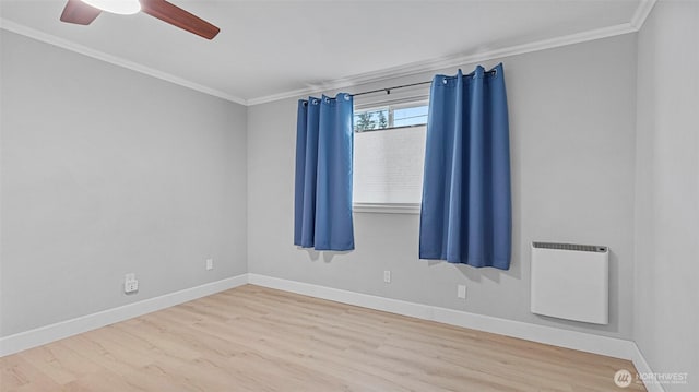 323 128th St SE Unit K120, Everett, WA 98208 - empty room featuring crown molding, wood finished floors, baseboards, and ceiling fan