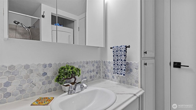 323 128th St SE Unit K120, Everett, WA 98208 - bathroom featuring decorative backsplash and vanity