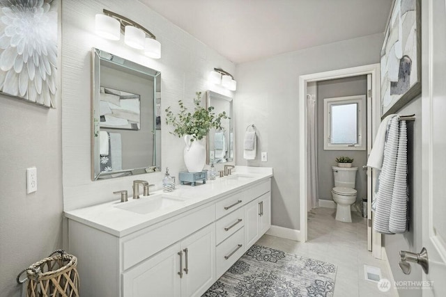 23510 14th Dr SE, Bothell, WA 98021 - full bathroom featuring double vanity, toilet, tile patterned floors, baseboards, and curtained shower
