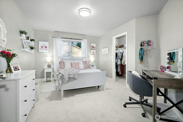 23510 14th Dr SE, Bothell, WA 98021 - bedroom featuring light carpet, a walk in closet, baseboards, and a desk
