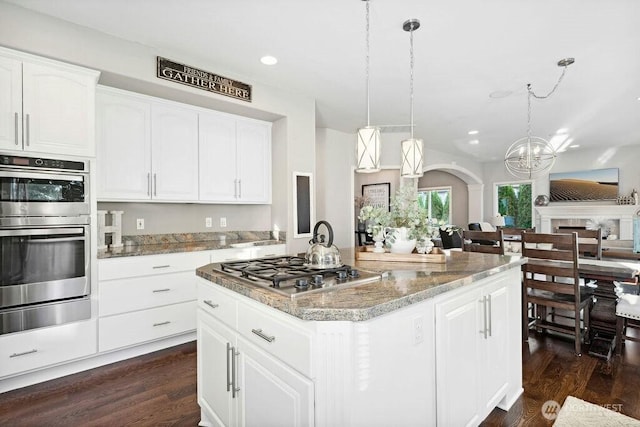 23510 14th Dr SE, Bothell, WA 98021 - kitchen with appliances with stainless steel finishes, recessed lighting, light stone countertops, dark wood-style floors, and a chandelier