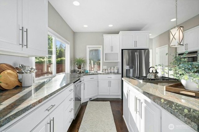 23510 14th Dr SE, Bothell, WA 98021 - kitchen with white cabinetry, appliances with stainless steel finishes, a sink, light stone countertops, and recessed lighting