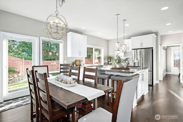 23510 14th Dr SE, Bothell, WA 98021 - dining area featuring dark wood finished floors, a chandelier, and recessed lighting