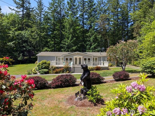 3758 Aiken Rd SE, Port Orchard, WA 98366 - view of front of property featuring a front lawn, a deck, and french doors