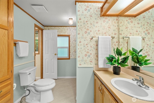 3758 Aiken Rd SE, Port Orchard, WA 98366 - bathroom with vanity, toilet, crown molding, wallpapered walls, and baseboards