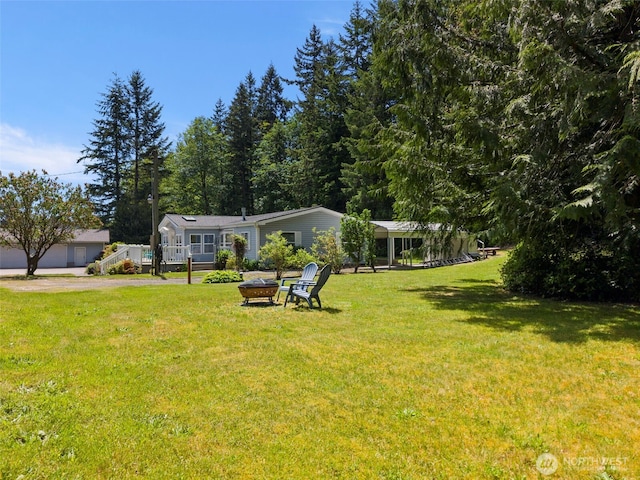 3758 Aiken Rd SE, Port Orchard, WA 98366 - view of front of property featuring an outdoor fire pit and a front yard