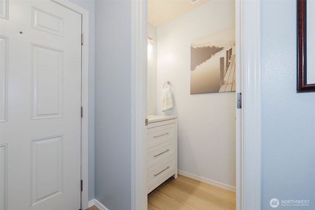 2760 SW Jabirin Way, Port Orchard, WA 98367 - bathroom featuring wood finished floors, vanity, and baseboards