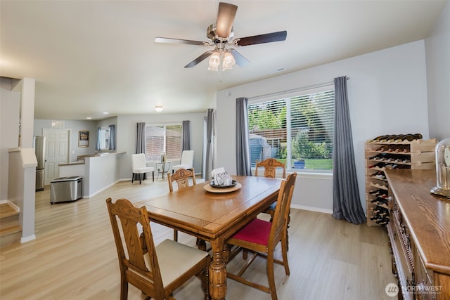 2760 SW Jabirin Way, Port Orchard, WA 98367 - dining room with light wood-style floors, baseboards, and a ceiling fan