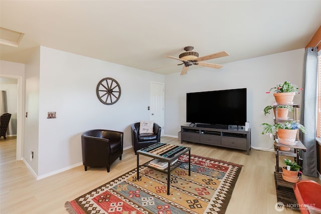 2760 SW Jabirin Way, Port Orchard, WA 98367 - living room with wood finished floors, ceiling fan, baseboards, and attic access