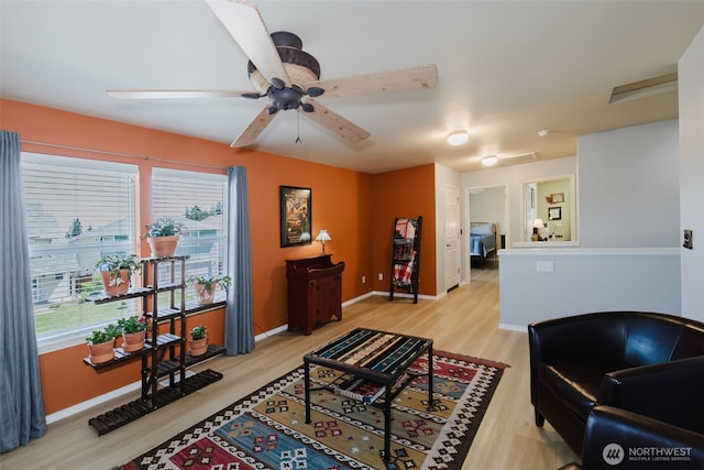 2760 SW Jabirin Way, Port Orchard, WA 98367 - living room featuring wood finished floors, a ceiling fan, and baseboards