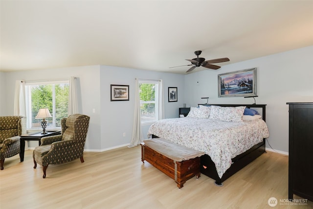 2760 SW Jabirin Way, Port Orchard, WA 98367 - bedroom with light wood-style flooring, multiple windows, and baseboards