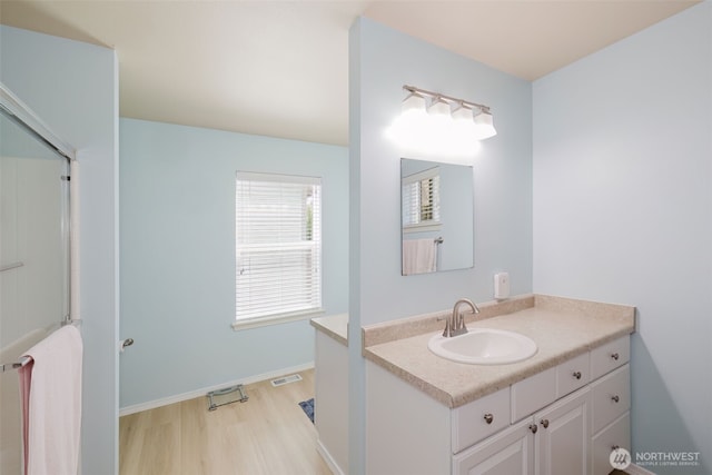 2760 SW Jabirin Way, Port Orchard, WA 98367 - bathroom with wood finished floors, vanity, and baseboards