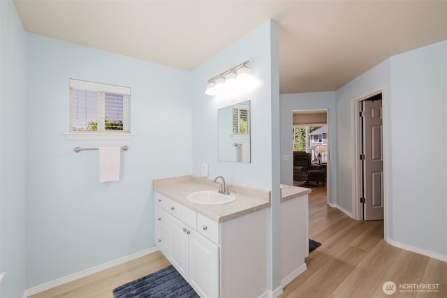 2760 SW Jabirin Way, Port Orchard, WA 98367 - bathroom with vanity, wood finished floors, and baseboards